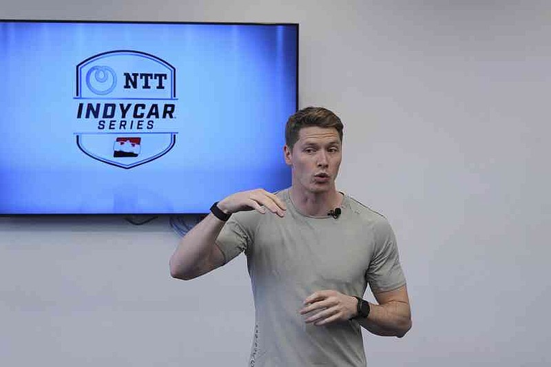 Two-time IndyCar series champion Josef Newgarden leads a group through the paces of his physical workout, a cross-fit session designed to fine-tune the entire body for strength and endurance in racing, Thursday, March 13, 2025, in Austin, Texas. (AP Photo/Eric Gay)