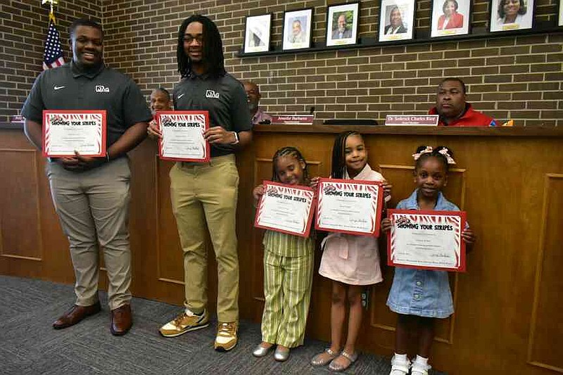 From left: X'zaeviun Sims, Omarion Tucker, Journee Jones, Nova Ridgell and Annisa Jenkins receive Showing Your Stripes certificates from the Pine Bluff School District. (Pine Bluff Commercial/I.C. Murrell)