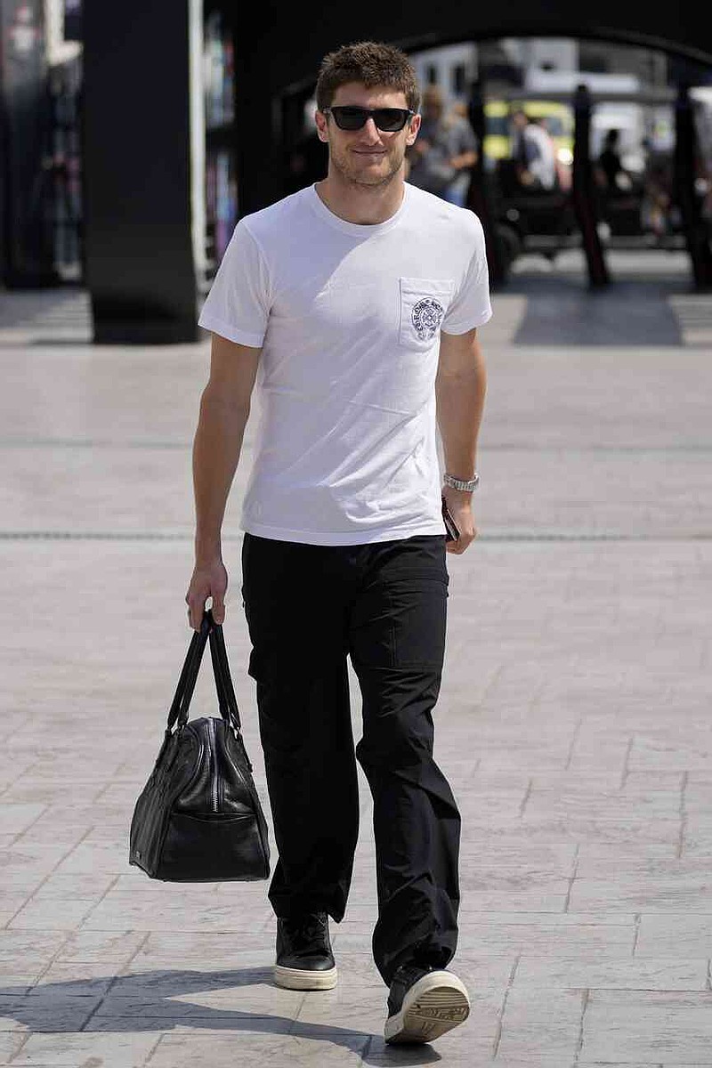 Alpine driver Jack Doohan of Australia walks through the paddock ahead of the Formula One Saudi Arabian Grand Prix at the Jeddah Corniche Circuit in Jeddah, Saudi Arabia, Thursday, April 17, 2025. (AP Photo/Darko Bandic)
