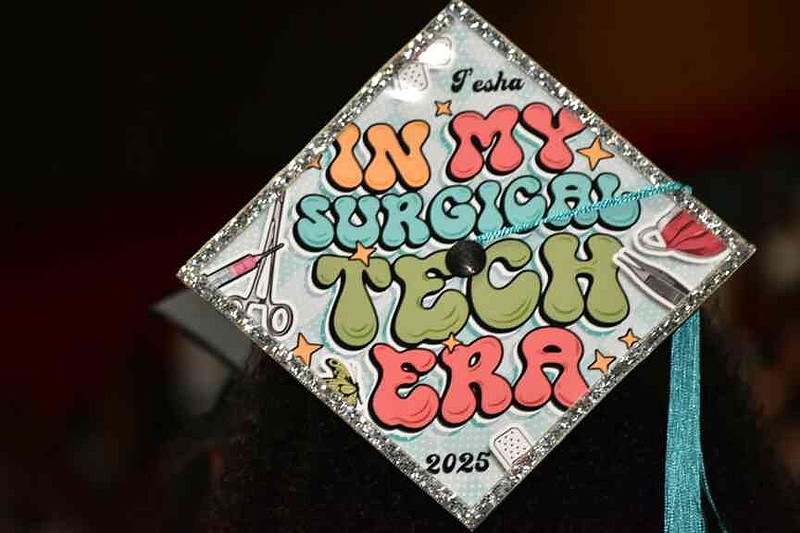 A graduate announces she has entered her surgical tech era. (Pine Bluff Commercial/I.C. Murrell)