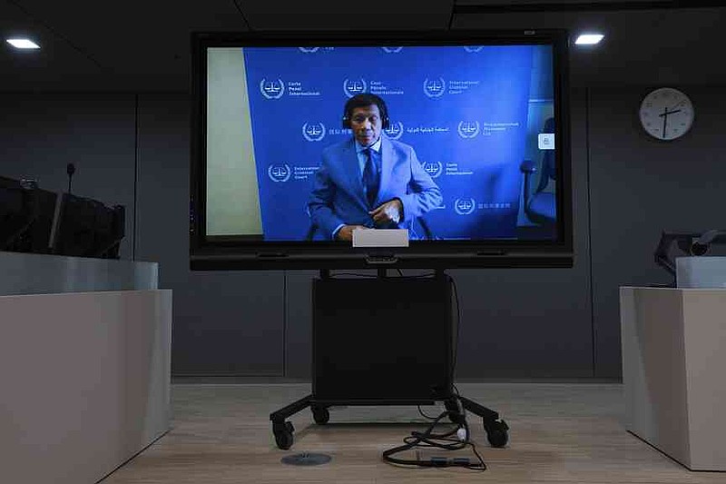 FILE - Former Philippine President Rodrigo Duterte is seen on a screen in the courtroom of the International Criminal Court (ICC) in The Hague, Netherlands, March 14, 2025. (AP Photo/Peter Dejong, Pool, file)