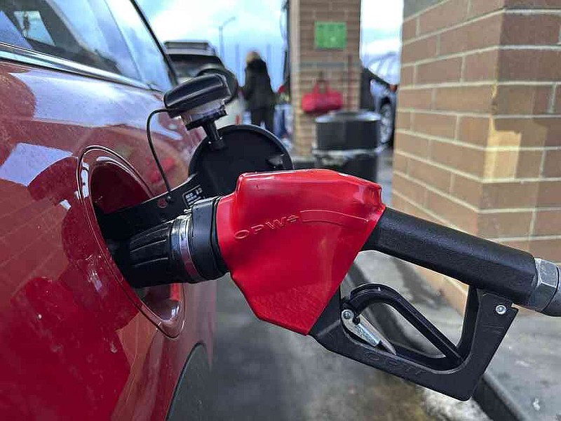 FILE - A motorist fills up the tank of a vehicle at a Costco gasoline station late Sunday, Feb. 16, 2025, in Sheridan, Colo. (AP Photo/David Zalubowski, File)