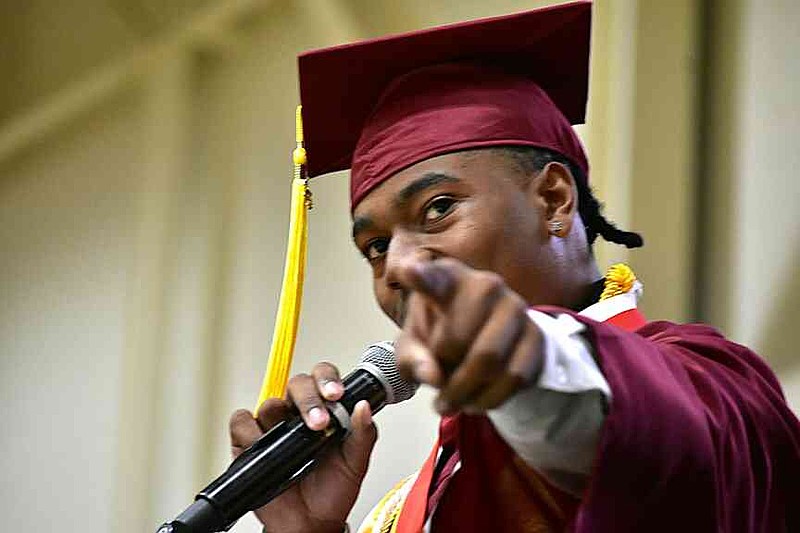 Keyon Smith points to his family early in his valedictory speech. (Pine Bluff Commercial/I.C. Murrell)