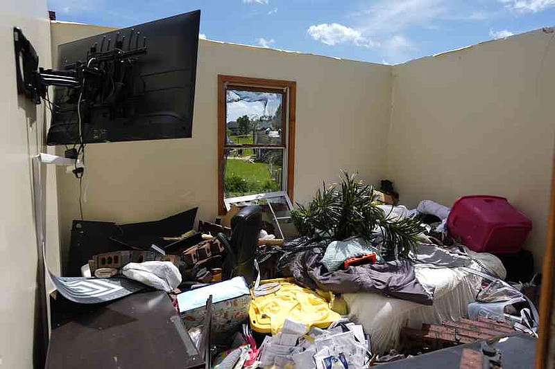 A home is destroyed after a severe storm passed the area on Saturday, May 17, 2025 in London, Ky. (AP Photo/Carolyn Kaster)