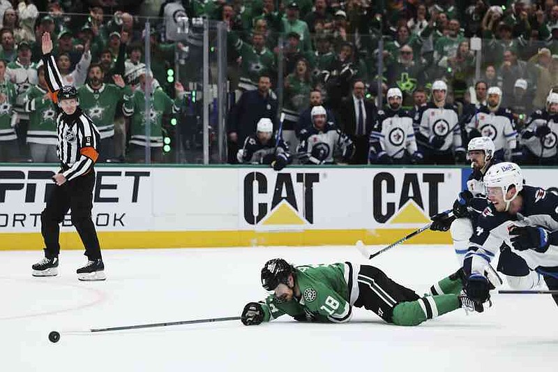 Dallas Stars Center Sam Steel (18) stumbled into the second round in Dallas, Saturday, May 17, 2025, by Mark Scheifele from Winnipeg Jets in the third period 6 of an NHL hockey playoff series. (AP Photo/Gareth Patterson)