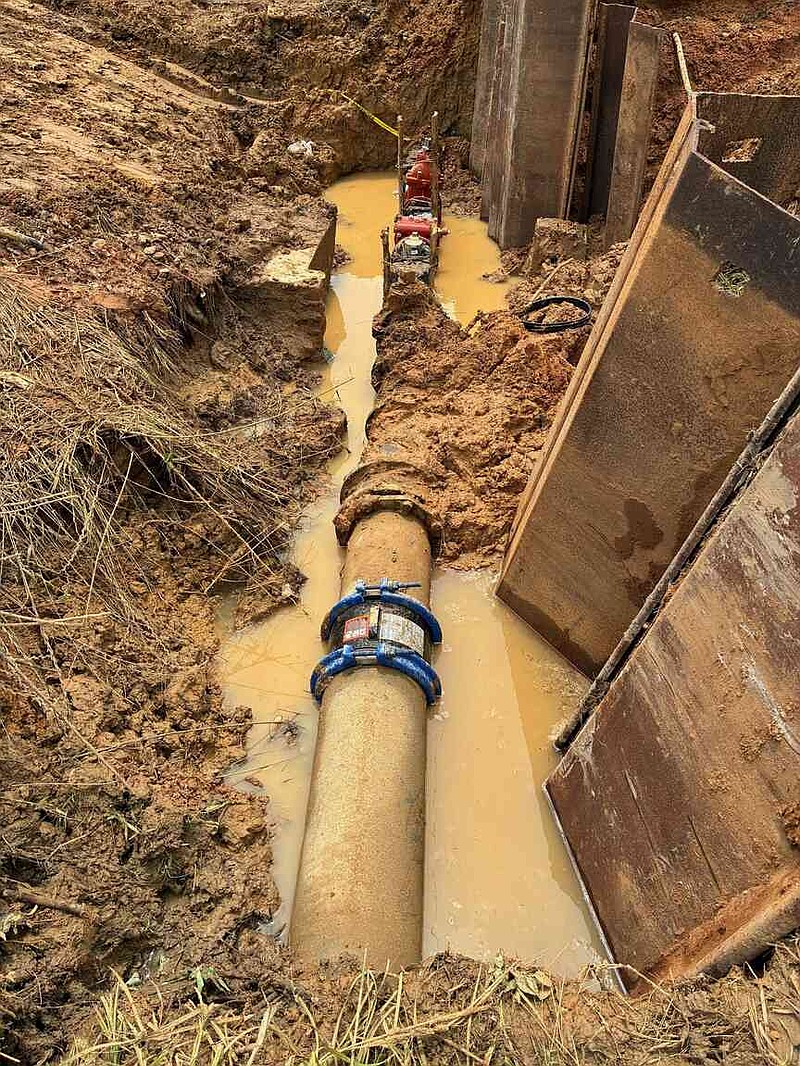 Two water lines were joined allowing water from the Sheridan Water Department to be sent to customers of two adjoining water associations after a fire seriously damaged their water treatment facility. (Pine Bluff Commercial/Byron Tate)