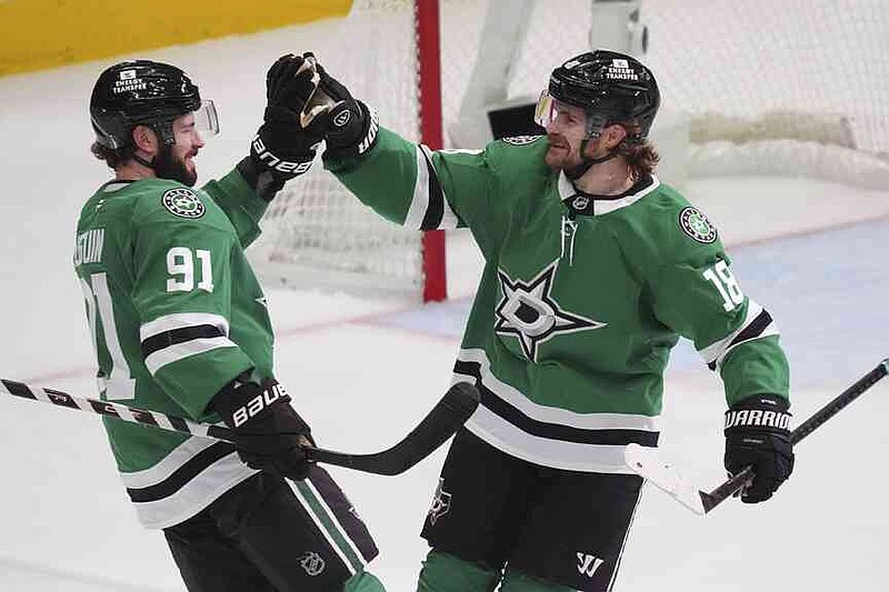 The Dallas Stars Center Tyler Seguin (91) celebrates its destination with team -mate Sam Steel (18) in the third period in the first game of the Western Conference Finals in the NHL -Hockey Stanley Cup Playoffs against the Edmonton Oilers, Wednesday, May 21, 2025, in Dallas. (AP Photo/LM Otero)