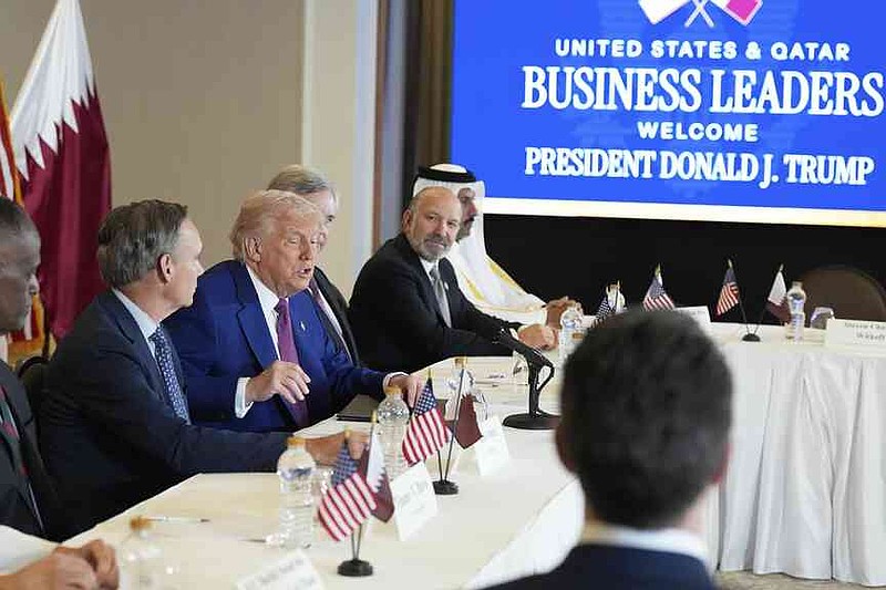 President Donald Trump speaks, sits between Kelly Ortberg President and CEO von Boeing (Left, and Larry Culp, CEO of GE Aerospace, during a Business Roundtable on Thursday, May 15, 2025, in Doha, Qatar. (Ap photo/Alex Brandon)