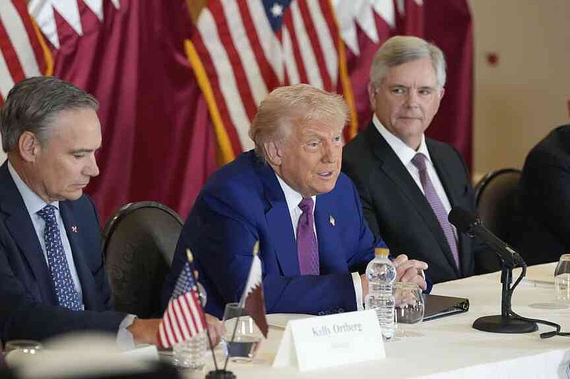 President Donald Trump speaks, sits between Kelly Ortberg President and CEO von Boeing (Left, and Larry Culp, CEO of GE Aerospace, during a Business Roundtable on Thursday, May 15, 2025, in Doha, Qatar. (Ap photo/Alex Brandon)