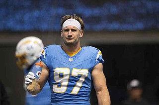 FILE - Los Angeles Chargers linebacker Joey Bosa drinks water before an NFL football game against the Las Vegas Raiders, Sept. 8, 2024, in Inglewood, Calif. (AP Photo/Kyusung Gong, File)