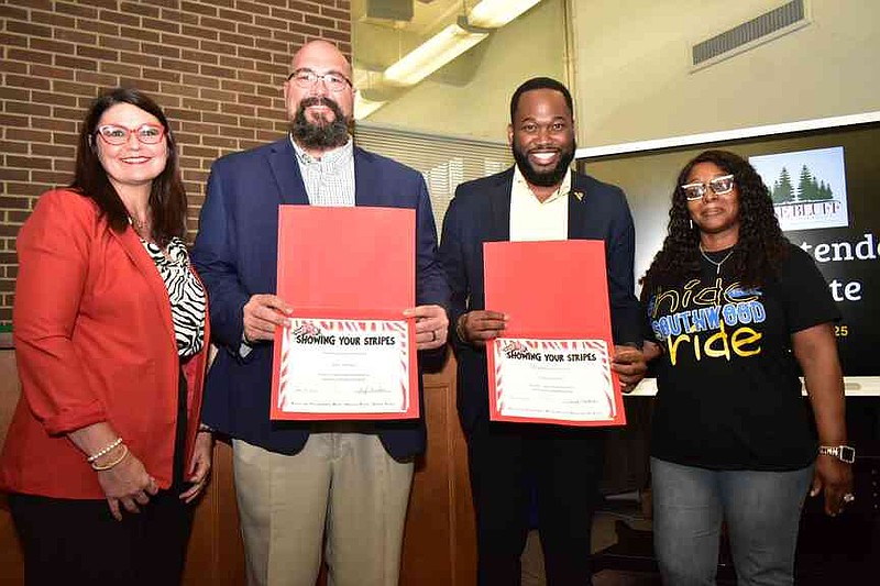 From left: Pine Bluff School District Superintendent Jennifer Barbaree present Showing Your Stripes certificates to John Varnell of Union Pacific and Frank D. Dorsey II of UAPB