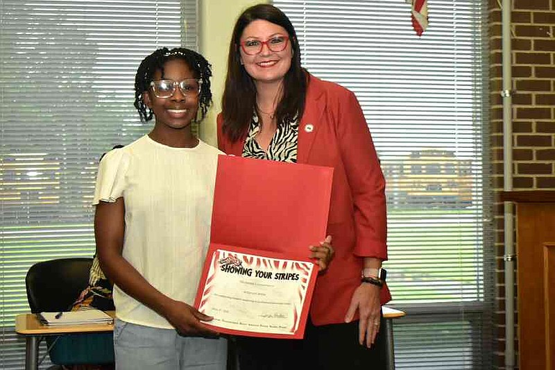 Amanda White, left, is awarded for outstanding student leadership at Southwood Elementary School. She poses with Pine Bluff School District Superintendent Jennifer Barbaree. (Pine Bluff Commercial/I.C. Murrell)