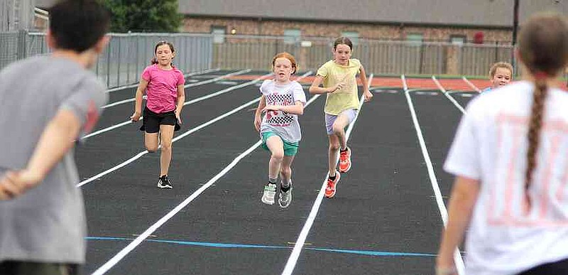 Annette Beard/Pea Ridge TIMES Lil Hawks Track Camp was well attended last week and culminated with a water slide on Thursday afternoon. For more photographs, go to the PRT gallery at https://tnebc.nwaonline.com/photos/.