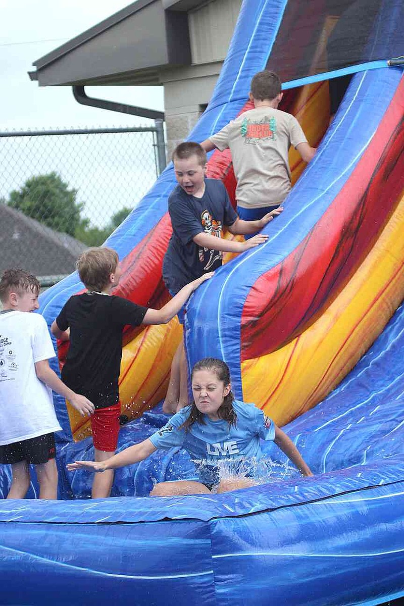 Annette Beard/Pea Ridge TIMES Lil Hawks Track Camp was well attended last week and culminated with a water slide on Thursday afternoon. For more photographs, go to the PRT gallery at https://tnebc.nwaonline.com/photos/.