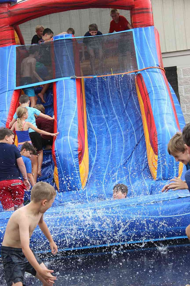 Annette Beard/Pea Ridge TIMES Lil Hawks Track Camp was well attended last week and culminated with a water slide on Thursday afternoon. For more photographs, go to the PRT gallery at https://tnebc.nwaonline.com/photos/.