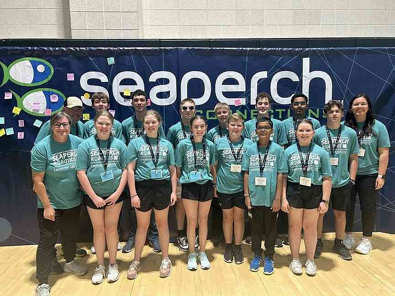 Students from the four Grant County 4-H SeaPerch teams stand with SeaPerch coaches Brad McGinley, back far left, Serena McGinley, front far left, and Tina Melton, far right back. (Special to The Commercial/University of Arkansas System Division of Agriculture)