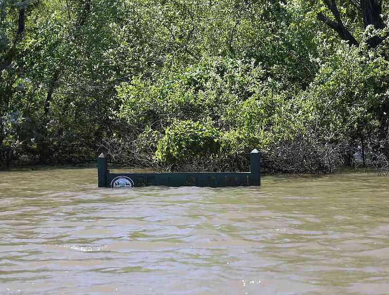 Watch for submerged signs, picnic tables and other obstructions when venturing into newly flooded areas. (Special to The Commercial/Mike Wintroath/Arkansas Game and Fish Commission)