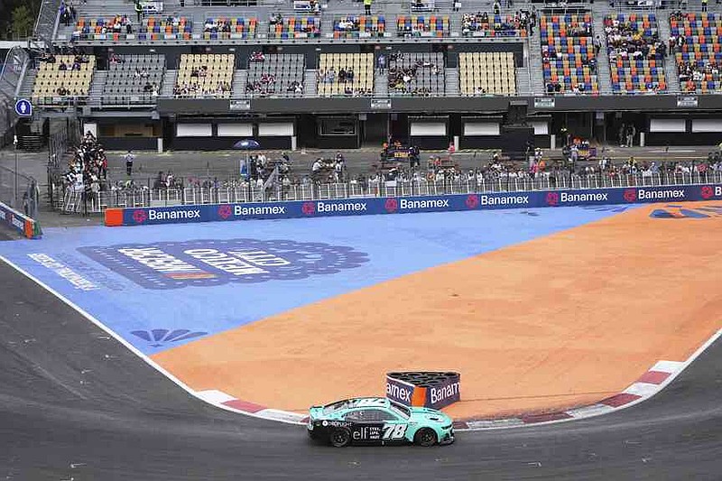 Katherine Legge drives during a qualifying session for the NASCAR Cup Series auto race at Hermanos Rodriguez race track in Mexico City, Saturday, June 14, 2025. (AP Photo/Fernando Llano)