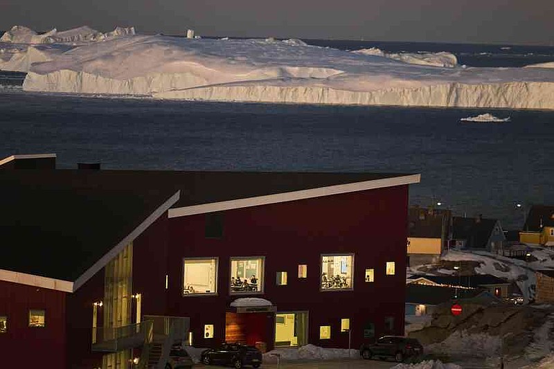 FILE - Public school pupils are seen inside their classrooms next to the large icebergs in Ilulissat, Greenland, Feb. 19, 2025. (AP Photo/Emilio Morenatti, File)