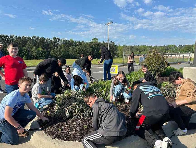 Students at L.M. Goza planted a pollinator garden as part of their curriculum last year to get outdoors and complete their certification in the Arkansas Game and Fish Commission's School of Conservation Leadership program. (Special to The Commercial/Michael Ankton)