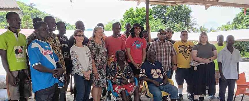 Professor Rebecca Lochmann of the University of Arkansas at Pine Bluff (first row, third from left standing) and her team visits people in Ghana. In 2024, faculty and students of UAPB and Delaware State University traveled to Ghana to promote opportunities in aquaculture and fisheries in the country. During the program, the cohort visited a fishing village, Adwafo, to discuss the challenges facing smallholder fish farmers. (Special to The Commercial/University of Arkansas at Pine Bluff)
