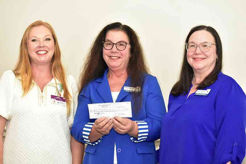 Laura Beth Shaner; Ollie Merritt and Kandy McClain of Voices for Children. (Pine Bluff Commercial/I.C. Murrell)