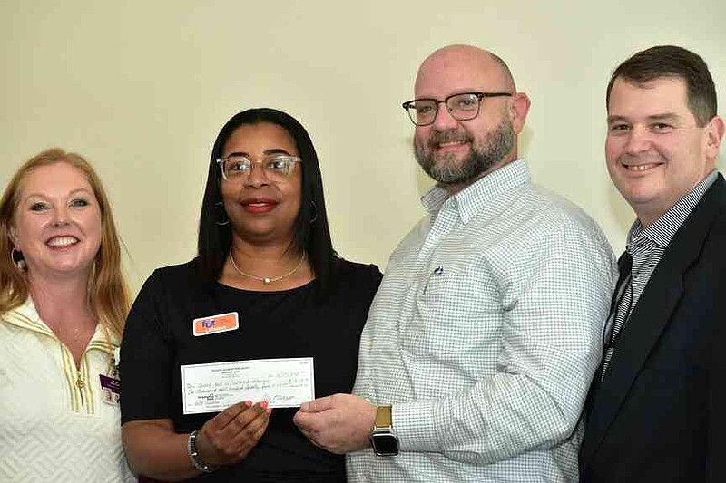 Laura Beth Shaner; LaTasha Randle, president of the United Way of Southeast Arkansas; Jason Duren, director of the United Way for Southeast Arkansas; and Owen McNulty. (Pine Bluff Commercial/I.C. Murrell)