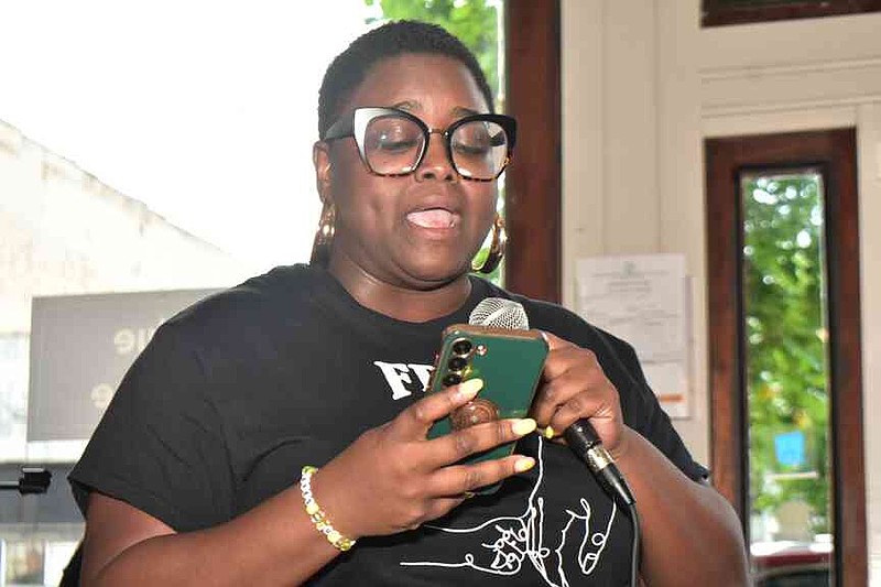 Katina White recites her poem, "Ode to Black Sisterhood" during a poetry slam at the Indigo Blue Coffeehouse on Thursday, June 19, 2025. (Pine Bluff Commercial/I.C. Murrell)