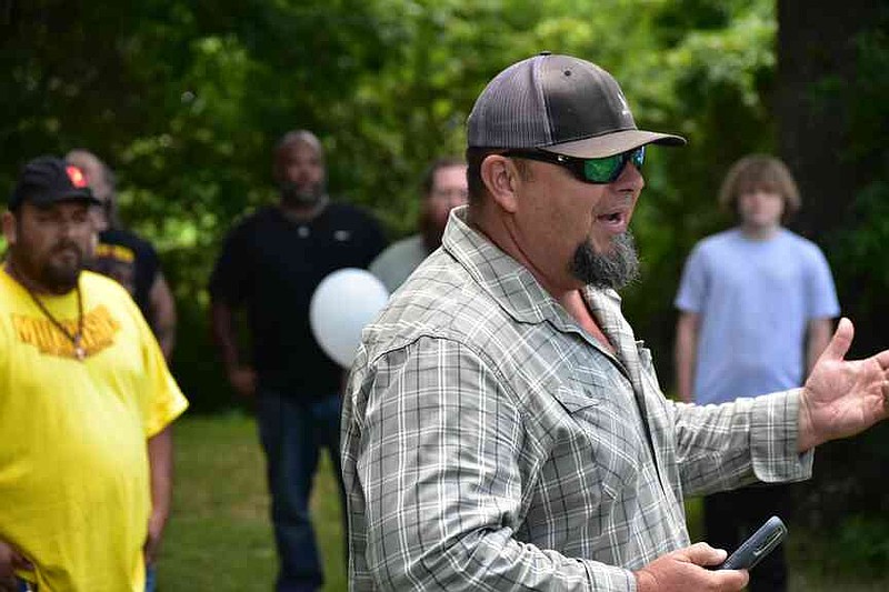 Kevin Hornaday, a Fordyce minister, offers comments during a balloon release marking the one-year anniversary of the mass shooting at a local grocery store. (Pine Bluff Commercial/I.C. Murrell)