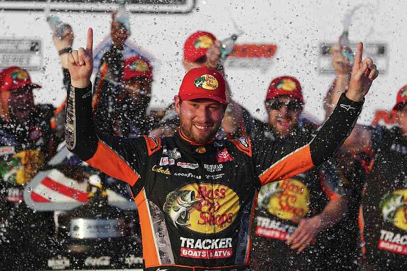 Chase Briscoe celebrates in Victory Lane after winning a NASCAR Cup Series auto race at Pocono Raceway, Sunday, June 22, 2025, in Long Pond, Pa. (AP Photo/Derik Hamilton)