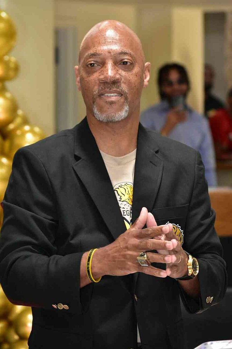 UAPB men's golf coach Roger Totten makes comments following the unveiling of a new trophy case. (Pine Bluff Commercial/I.C. Murrell)
