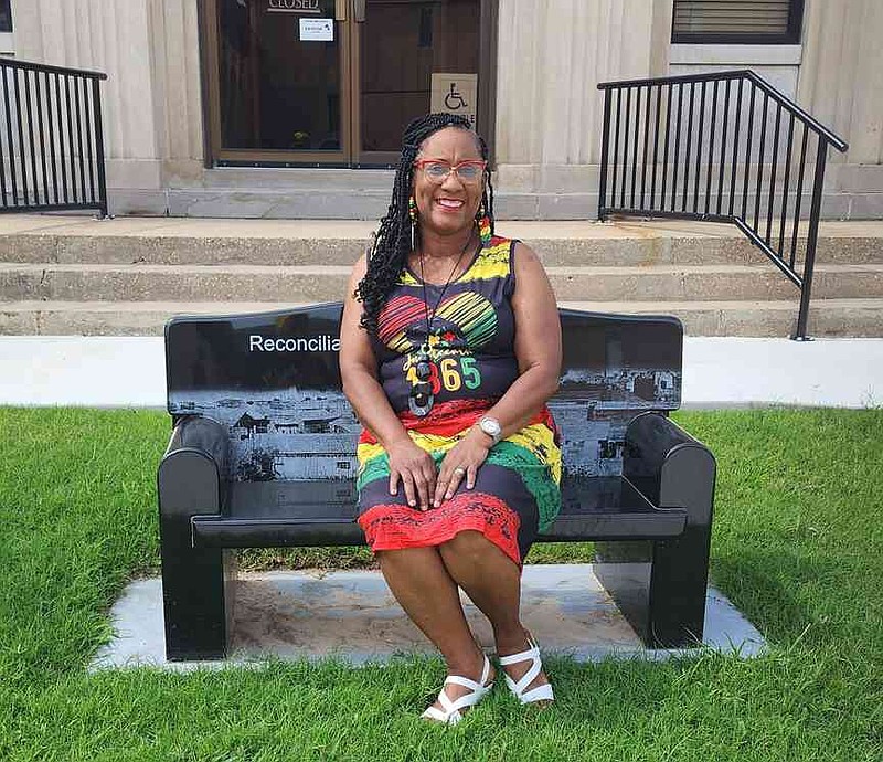 Drew County NAACP branch President Clarissa Pace sits on a reconciliation bench that will be fully unveiled during a ceremony Saturday morning, June 28, 2025. (Special to The Commercial/Clarissa Pace)