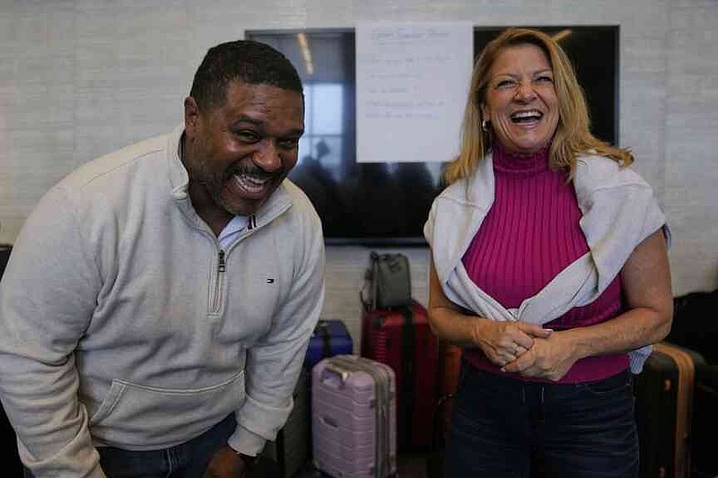 Rocky Mount Police Department Capt. James Staten, left, and Luann Pannell, director of instructional design and academic innovation with the Policing Leadership Academy, participate in an improvisational exercise lead by The Second City instructors during a Univeristy of Chicago Crime Lab class that is part of the Leadership program, on April 11, 2025, in Chicago. (AP Photo/Erin Hooley)
