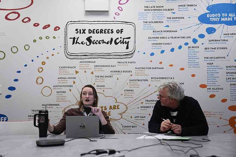 Strategic Client Partner Tree Branch, left, and Vice President, Creative Strategy, Innovation and Business Development Kelly Leonard talk during a planning meeting at The Second City improvisational comedy space, on March 26, 2025, in Chicago. (AP Photo/Erin Hooley)