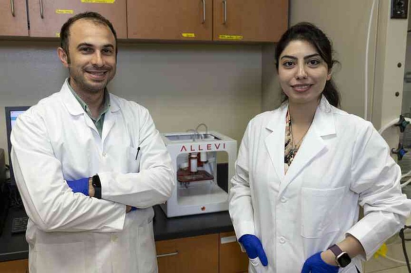 Ali Ubeyitogullari, left, an assistant professor of food engineering, worked with Sorour Barekat, a postdoctoral fellow in the food science department, to develop a new 3D 'bioink' from sorghum proteins. (Special to The Commercial/Paden Johnson/University of Arkansas System Division of Agriculture)