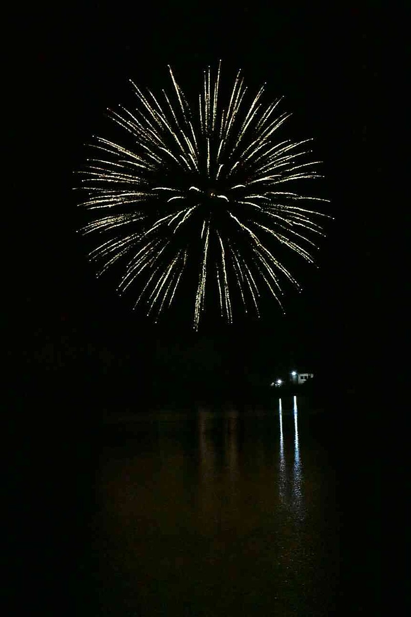Firecrackers light up the Pine Bluff sky over Lake Saracen on Friday, July 4, 2025. (Pine Bluff Commercial/I.C. Murrell)