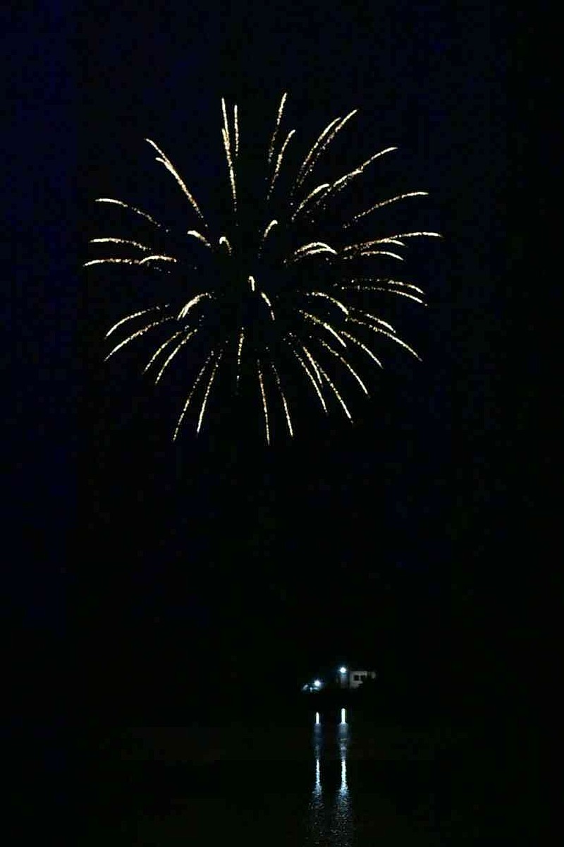 Firecrackers light up the Pine Bluff sky over Lake Saracen on Friday, July 4, 2025. (Pine Bluff Commercial/I.C. Murrell)