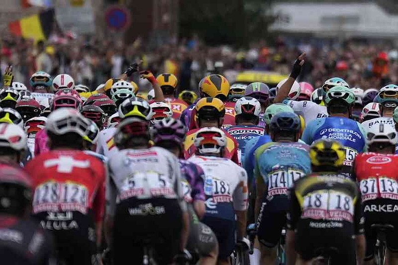 The pack rides during the first stage of the Tour de France cycling race over 184.9 kilometers (114.9 miles) with start and finish in Lille, France, Saturday, July 5, 2025. (AP Photo/Mosa'ab Elshamy)