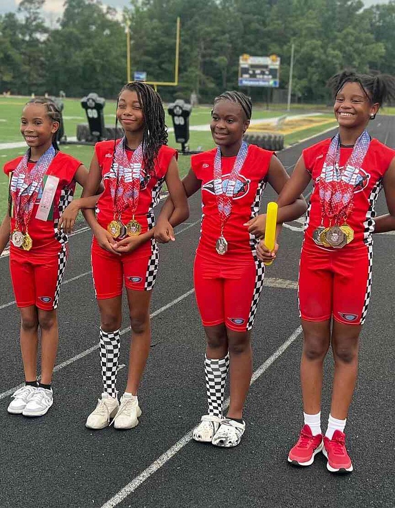 The 12-year-old 4x400-meter relay team of Khalie Piggie, Ariel Hargraves, Kali Smith and Akyre Ento. (Special to The Commercial)