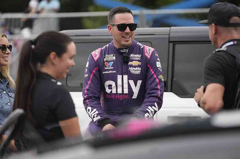 Driver Alex Bowman (48) talks with people before in a NASCAR Cup Series auto race at the Grant Park 165 , Sunday, July 6, 2025, in Chicago. (AP Photo/Erin Hooley)