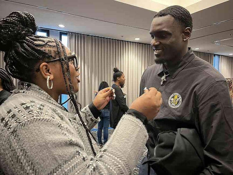 Semiyah Smith, left, talks with another participant, Jordan Jackson, at a conference. (Special to The Commercial/University of Arkansas at Pine Bluff)