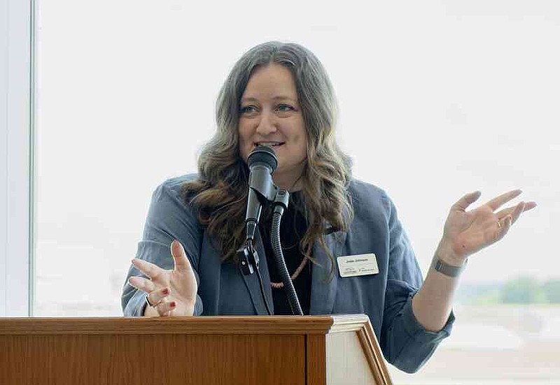 Josie Johnson, assistant curator of modern art at Crystal Bridges, speaks Thursday during a ribbon cutting ceremony for a new Crystal Bridges satellite gallery at the Northwest Arkansas National Airport. Northwest Arkansas National Airport (XNA) and Crystal Bridges Museum of American Art invited press to attend a ribbon cutting ceremony celebrating the opening of the museum's new satellite gallery in the airport terminal. Visit nwaonline.com/photo for today's photo gallery. (NWA Democrat-Gazette/Charlie Kaijo)