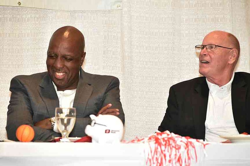 Former University of Arkansas basketball player Ernie Murry, left, and former assistant coach Wayne Stehlik laugh at jokes about Murry during SOAR's Roast and Toast. (Pine Bluff Commercial/I.C. Murrell)