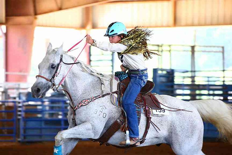 A rider shows off skills at the 2025 Arkansas 4-H Horse Show at the White County Fairgrounds in Searcy. (Special to The Commercial/Ryan McGeeney/University of Arkansas System Division of Agriculture)