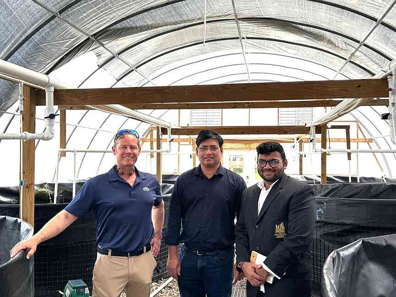 Infini-SEA CEO Jim Collins, left; Yathish Ramena, Ph.D, UAPB's aquaculture and fisheries center director; and UAPB graduate student Ram Babu Kurapati collaborate on shrimp research at Infini-SEA's facility. (Special to The Commercial/University of Arkansas at Pine Bluff)