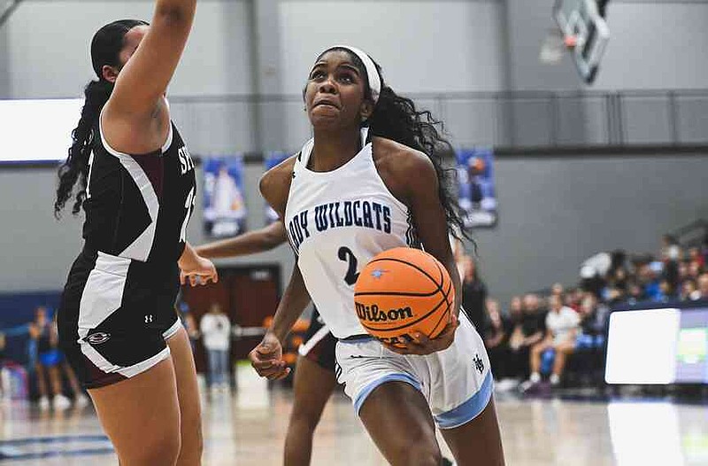 Springdale Har-Ber guard Brooklyn Owens (2) drives to the basket, Friday, February 28, 2025 during the first half of a basketball game at Har-Ber High School in Springdale. Owens played her senior season at Har-Ber after she spent the two previous seasons at Rogers.  (NWA Democrat-Gazette/Charlie Kaijo)