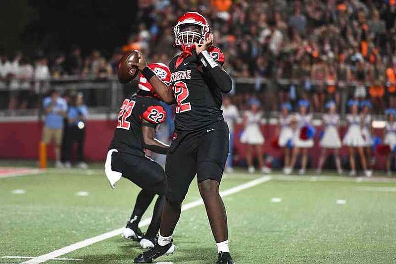 Fort Smith Northside quarterback Dorian Bowers (12) passes, Friday, Aug. 30, 2024, during the first quarter against Fort Smith Southside at Mayo-Thompson Stadium in Fort Smith. Bowers had been at Fayetteville for his sophomore season, and now he's returned to play his senior season with the Bulldogs. (River Valley Democrat-Gazette/Hank Layton)