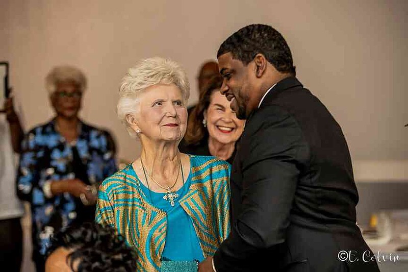 Sissy Jones, founder of Sissy's Log Cabin, greets Jefferson County Sheriff Lafayette Woods Jr. (Pine Bluff Commercial/Eplunus Colvin)
