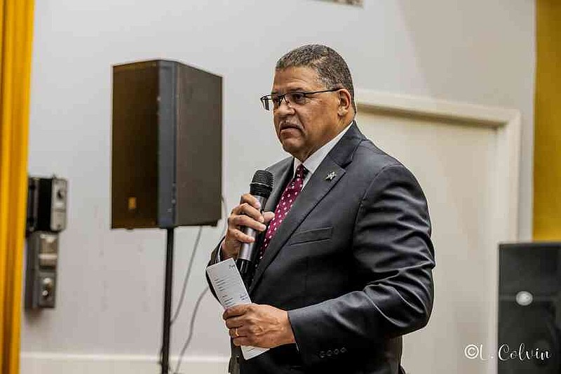 Pulaski County Sheriff Eric Higgins commends Sheriff Lafayette Woods Jr. for his commitment to service. (Pine Bluff Commercial/Eplunus Colvin)