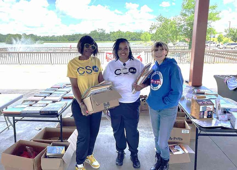 Kymberly Yarnell, right, enjoys distributing books and appreciates the Toys for Tots Literacy Program. (Special to The Commercial)